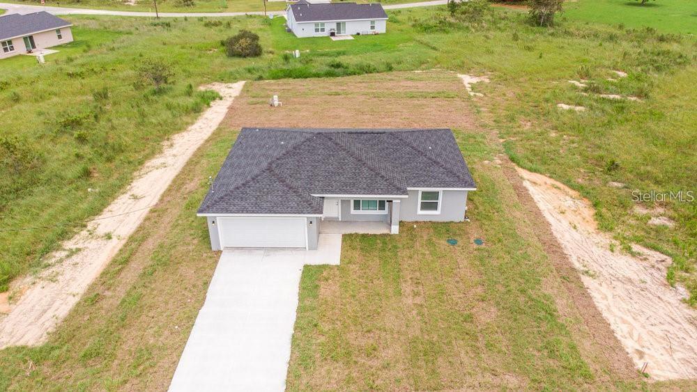 151 Malauka Road Ocklawaha, FL 32179 - Photo 11 of 29 a aerial view of a house with swimming pool