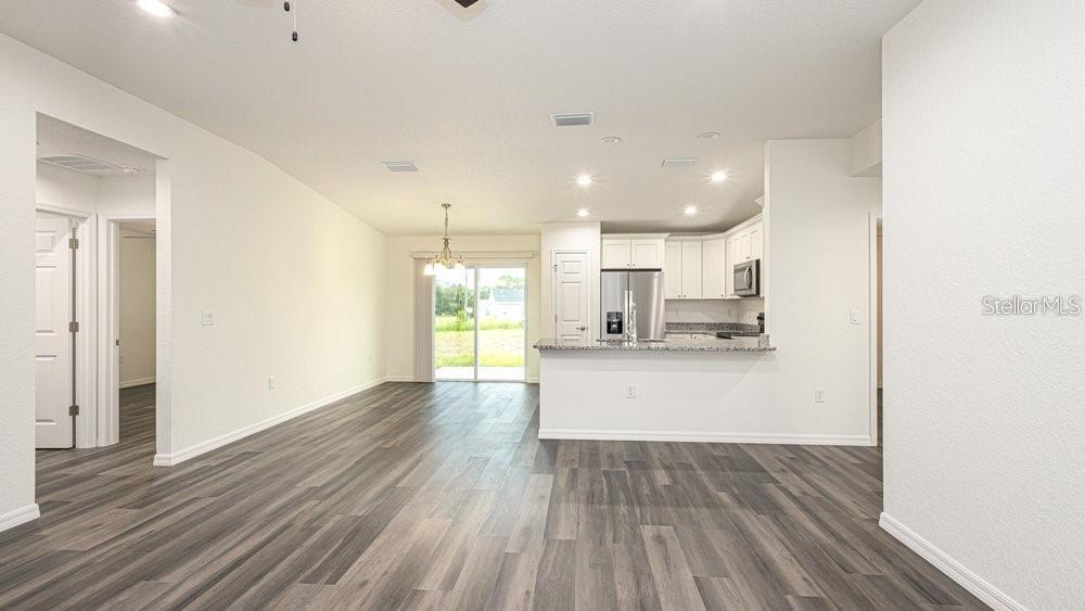 151 Malauka Road Ocklawaha, FL 32179 - Photo 13 of 29 a view of kitchen with wooden floor