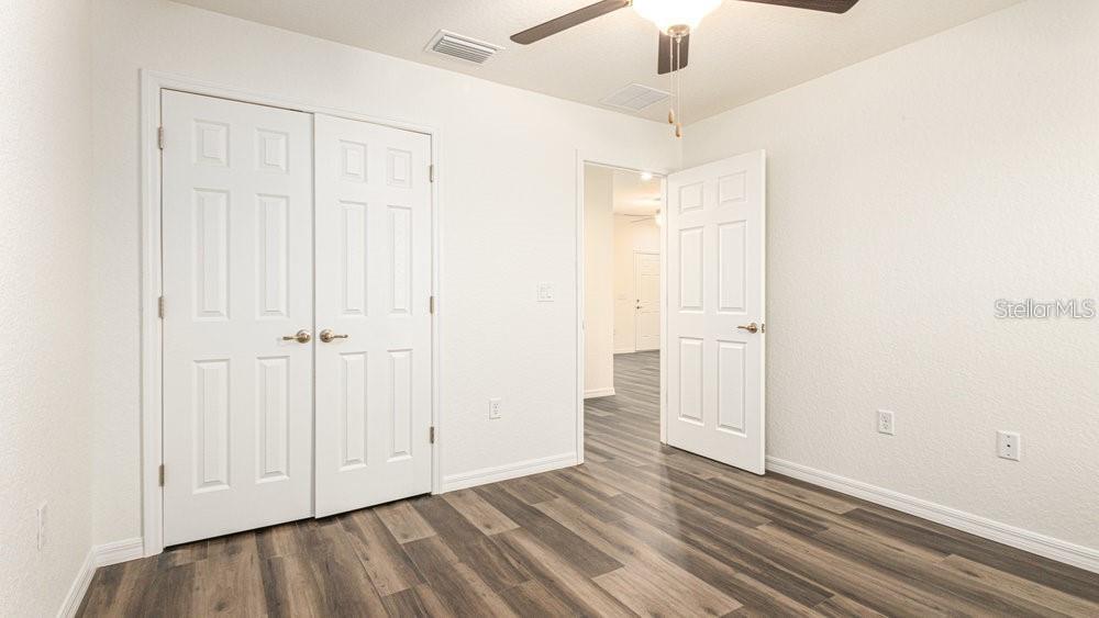 151 Malauka Road Ocklawaha, FL 32179 - Photo 21 of 29 wooden floor in an empty room
