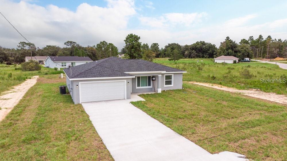 151 Malauka Road Ocklawaha, FL 32179 - Photo 10 of 29 front view of a house with a yard