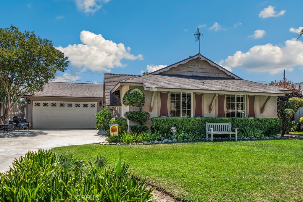 8514 Camelia Drive Riverside, CA 92504 - Photo 1 of 1 a front view of a house with garden