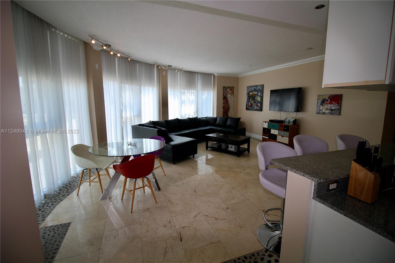 275 Northeast 18th Street, Unit 306 Miami, FL 33132 - Photo 5 of 15 a living room with furniture and a window