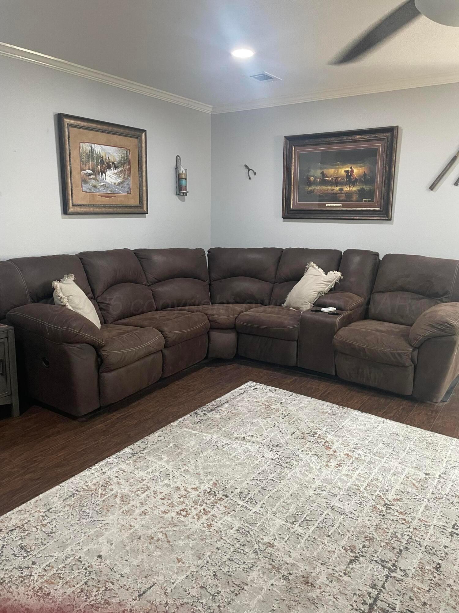 6716 Brookview Way Amarillo, TX 79124 - Photo 3 of 15 a living room with furniture and a large window