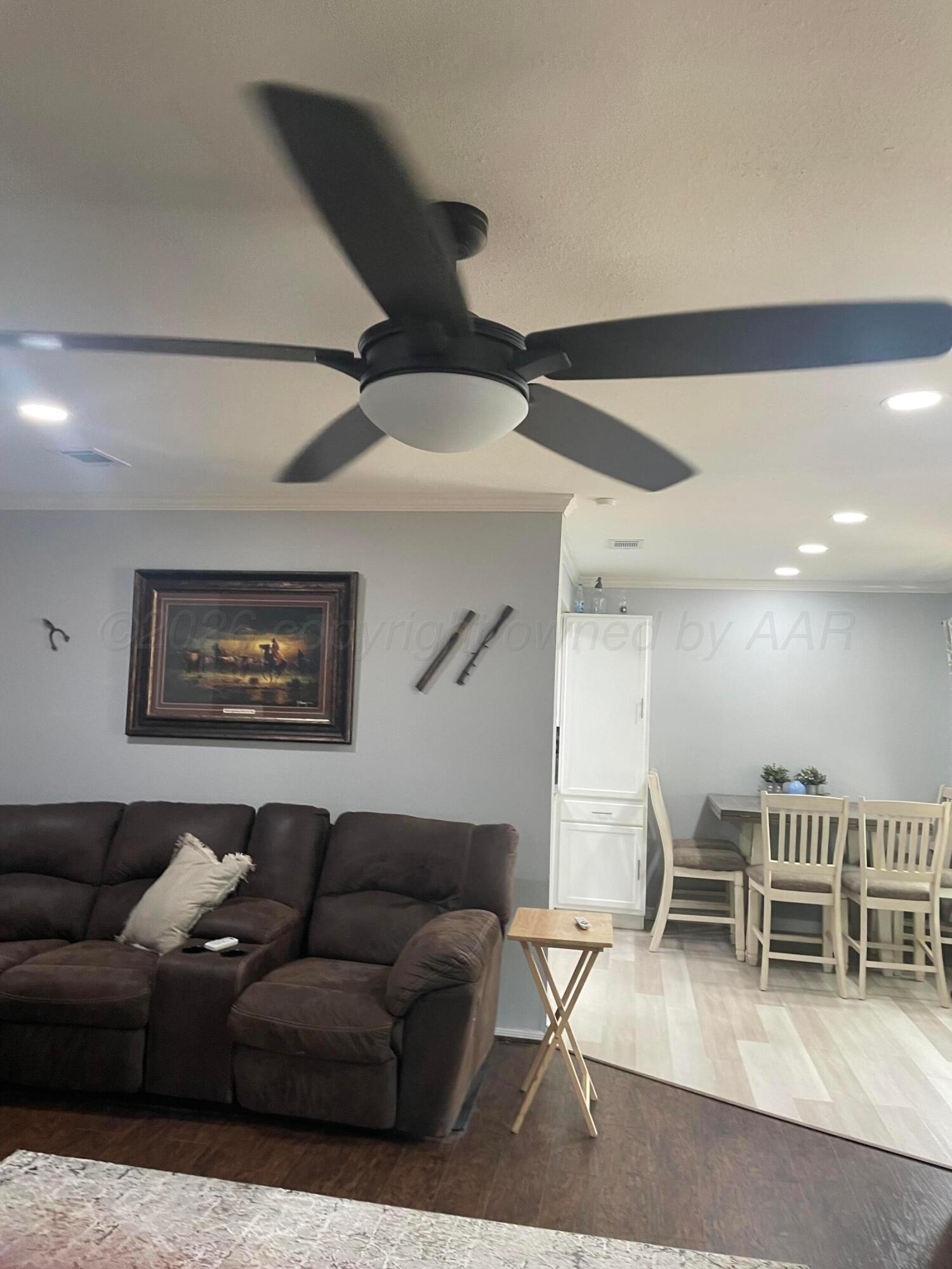 6716 Brookview Way Amarillo, TX 79124 - Photo 5 of 15 a living room with furniture and kitchen view