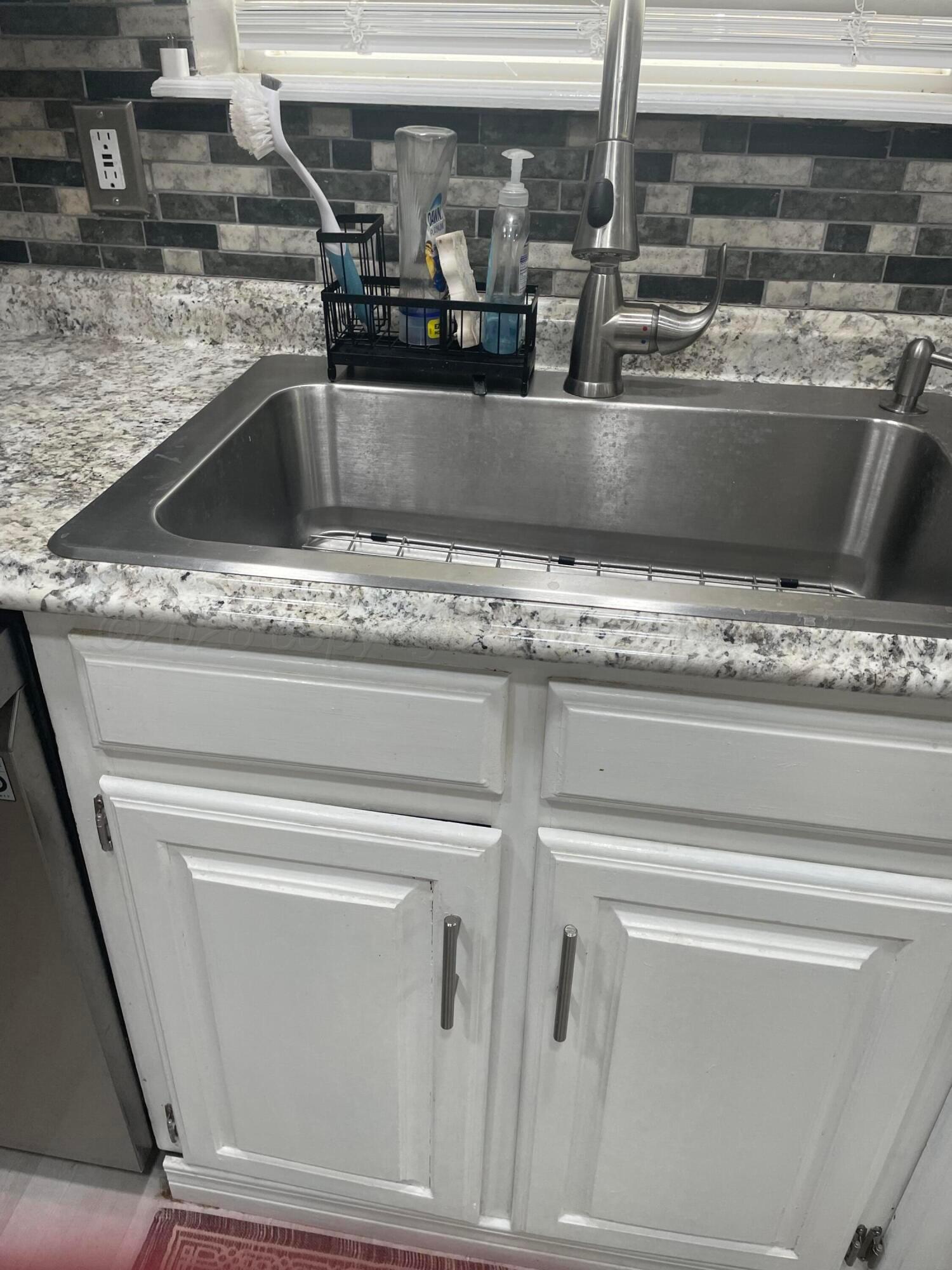 6716 Brookview Way Amarillo, TX 79124 - Photo 10 of 15 a close view of sink and tap