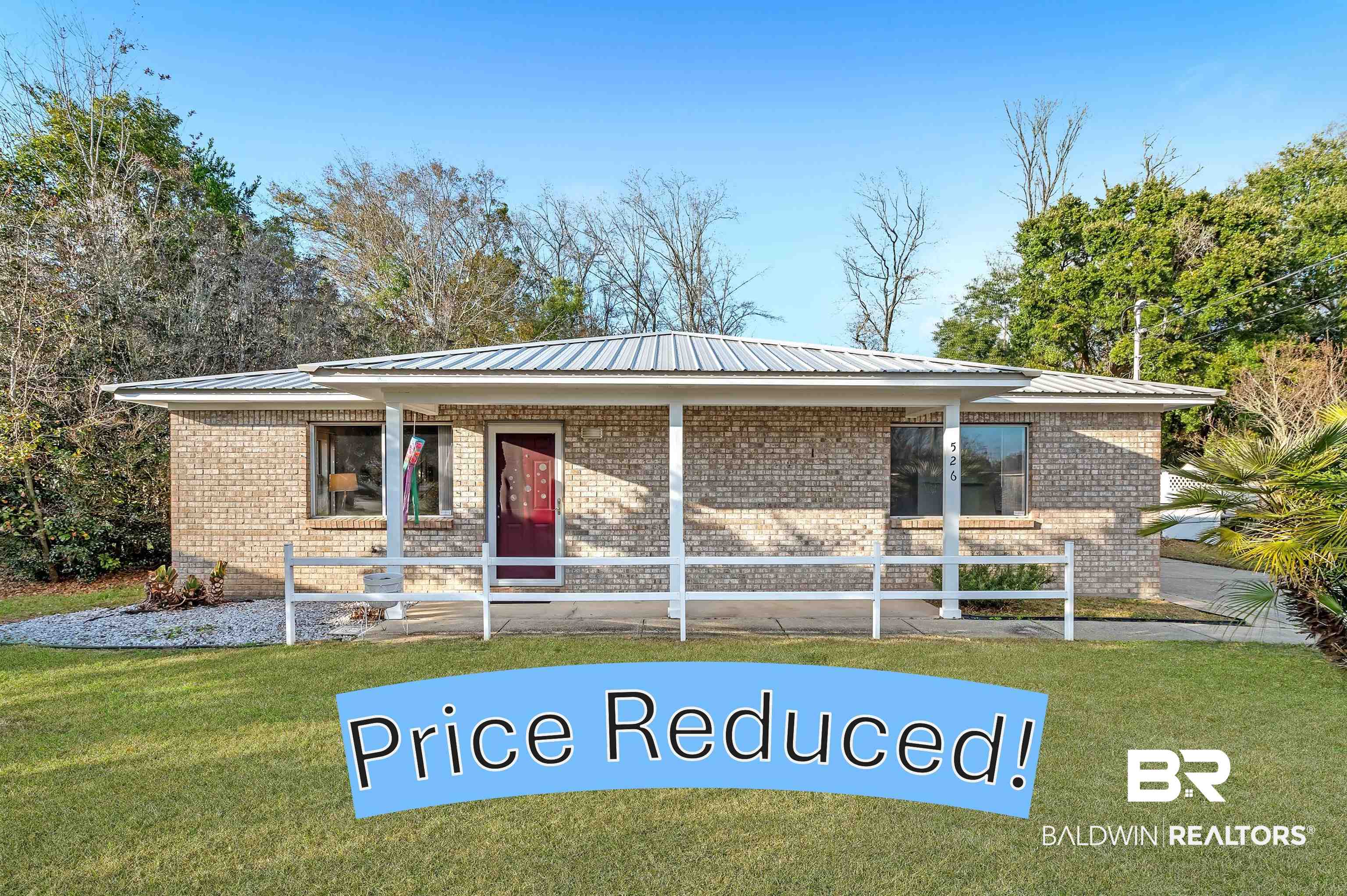 526 Ariel Avenue Foley, AL 36535 - Photo 1 of 33 Ranch-style house with metal roof, brick siding, and a front yard