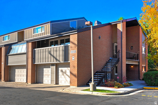 Undisclosed Address Salt Lake City, UT 84106 - Photo 1 of 1 View of property featuring an attached garage and stairway