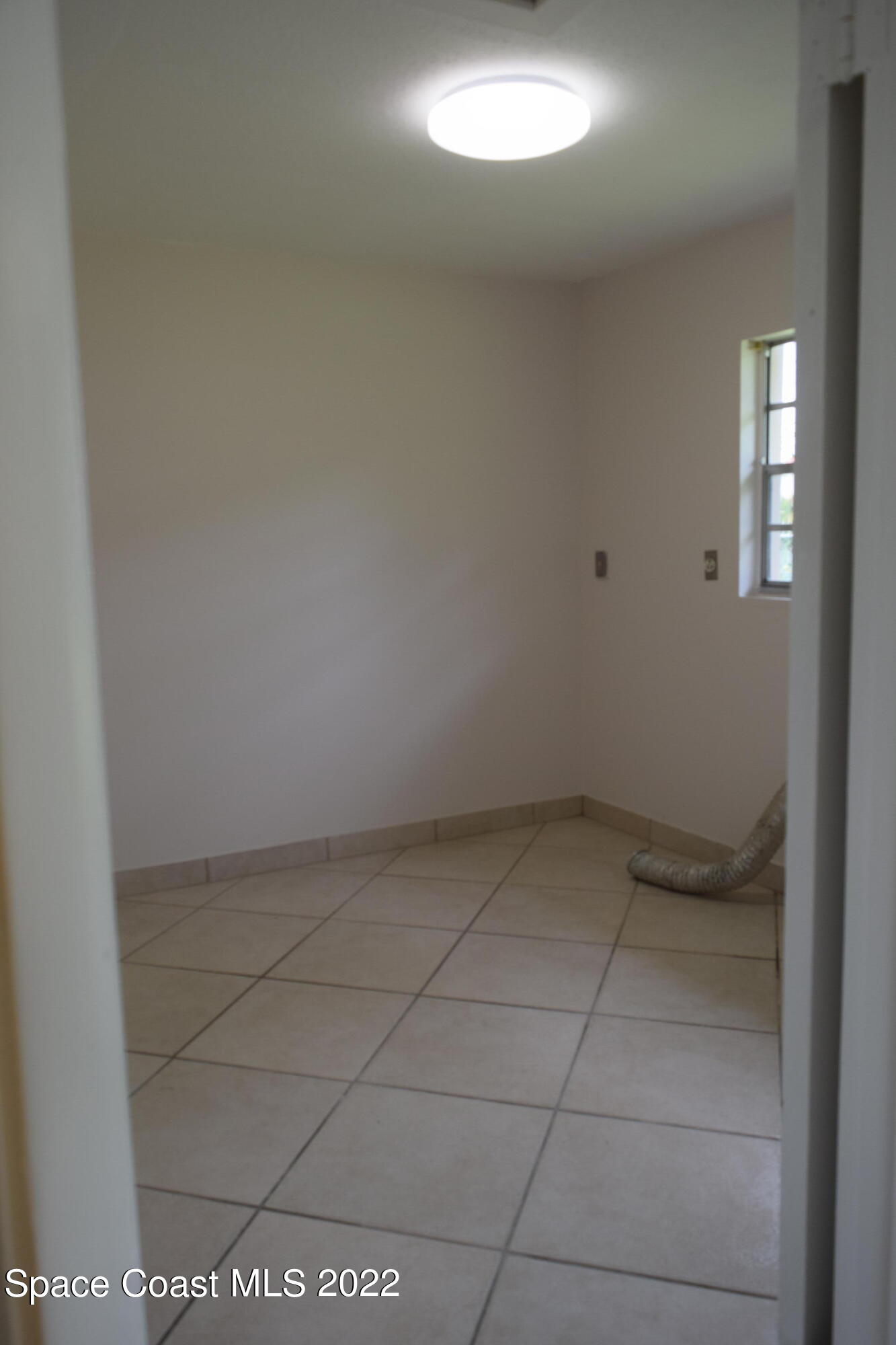 771 Cobblestone Lane Northeast Palm Bay, FL 32905 - Photo 11 of 30 a view of utility room