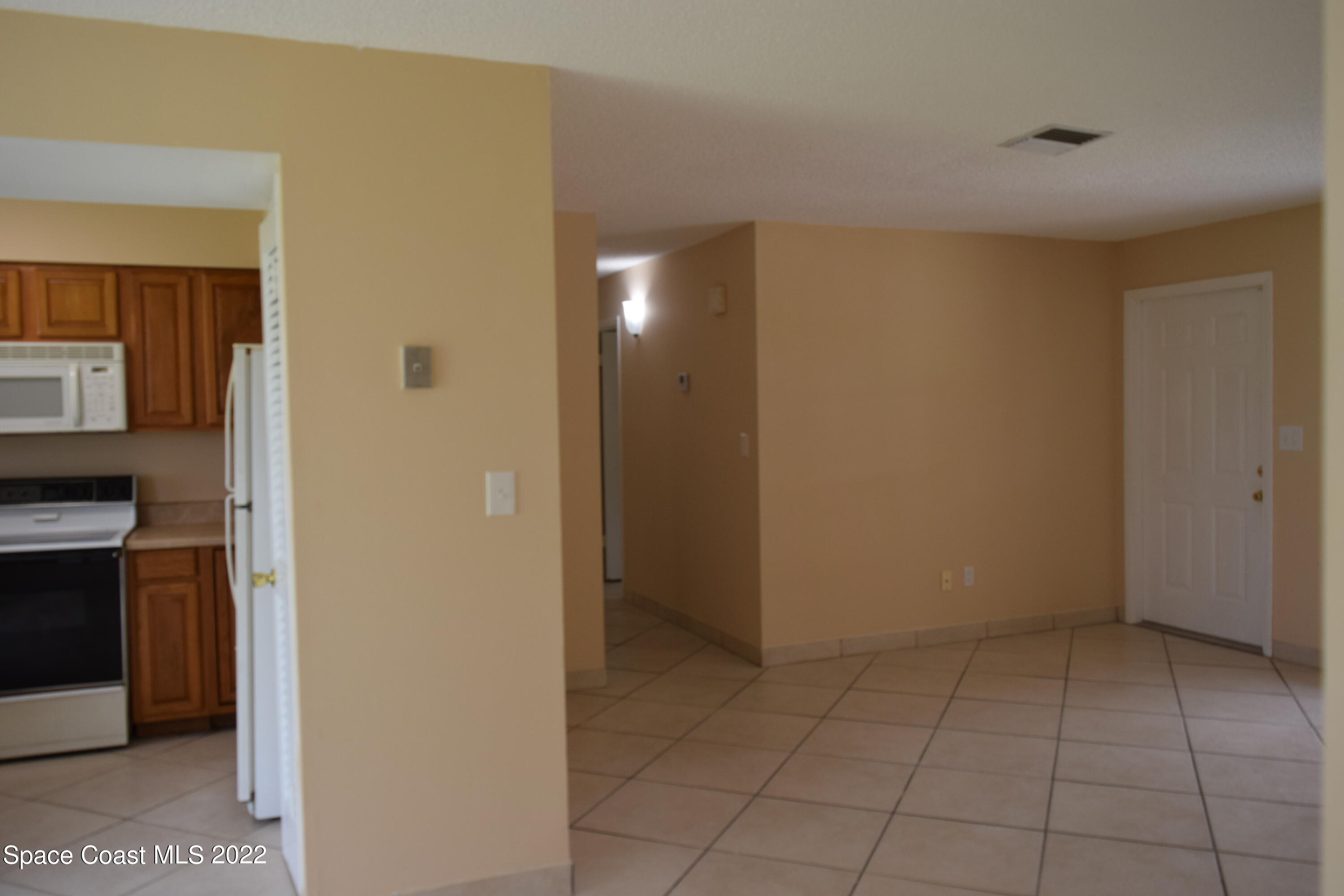 771 Cobblestone Lane Northeast Palm Bay, FL 32905 - Photo 14 of 30 a view of an empty room with closet area
