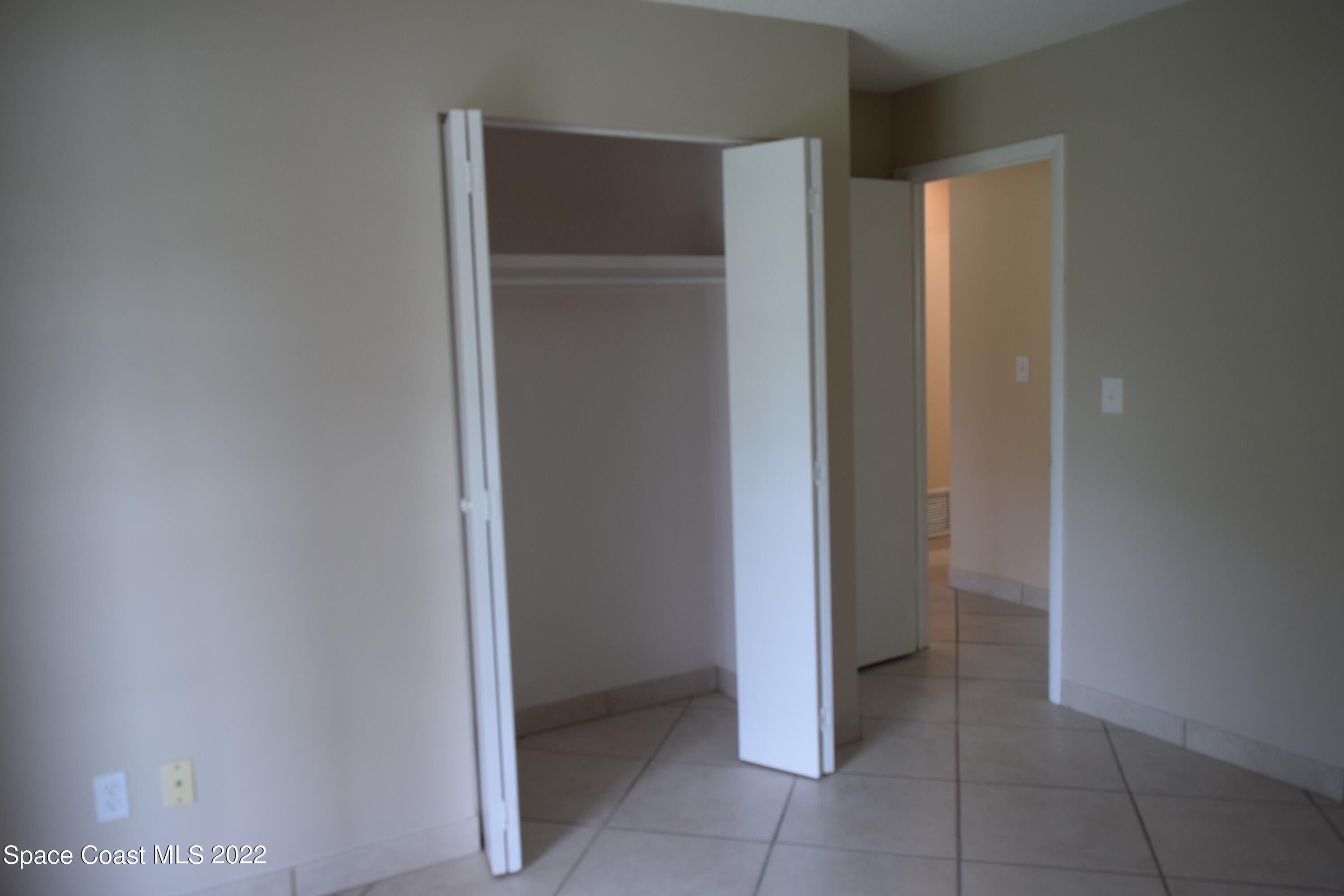 771 Cobblestone Lane Northeast Palm Bay, FL 32905 - Photo 22 of 30 a view of an empty room