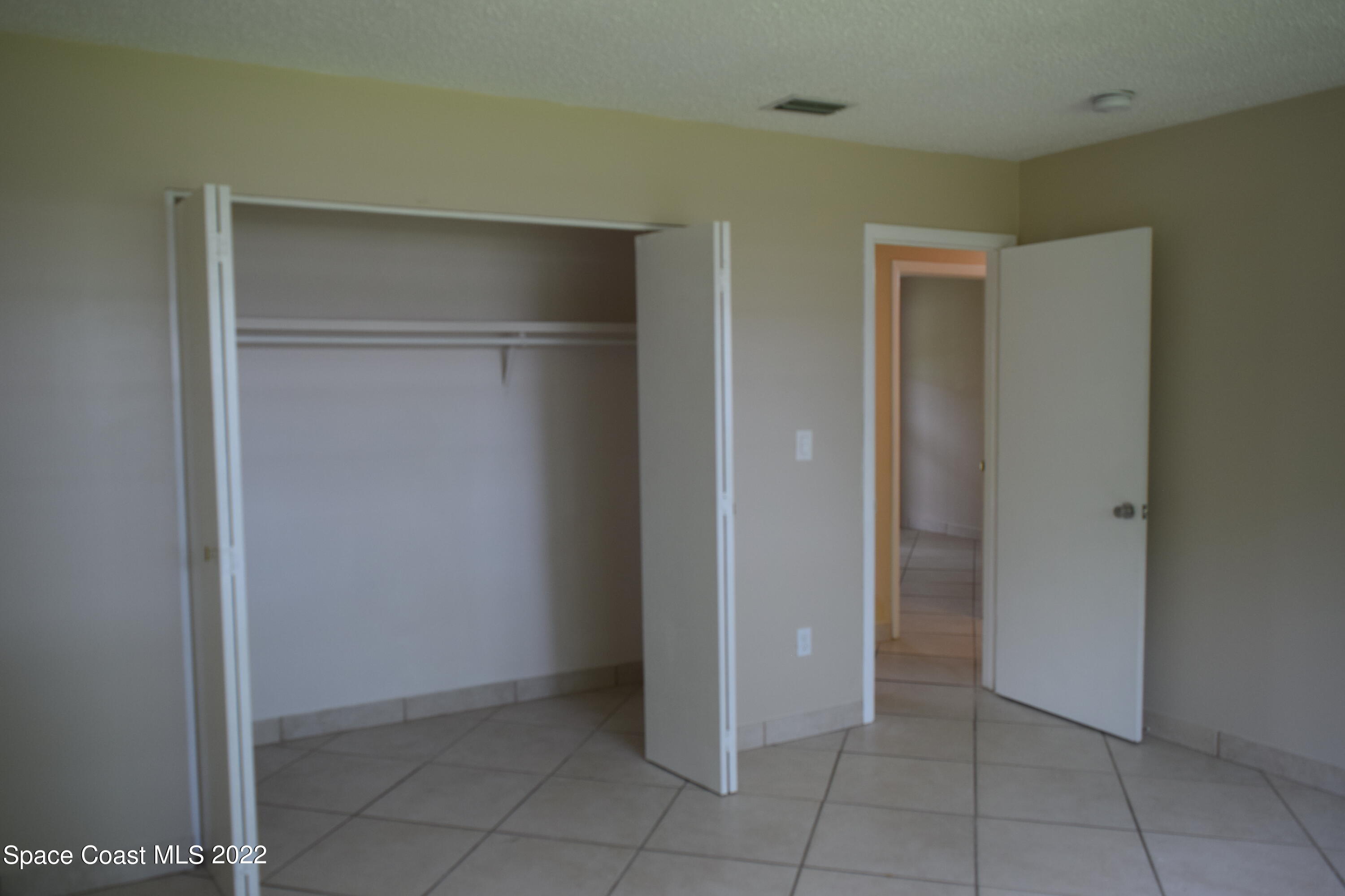 771 Cobblestone Lane Northeast Palm Bay, FL 32905 - Photo 24 of 30 a view of an empty room