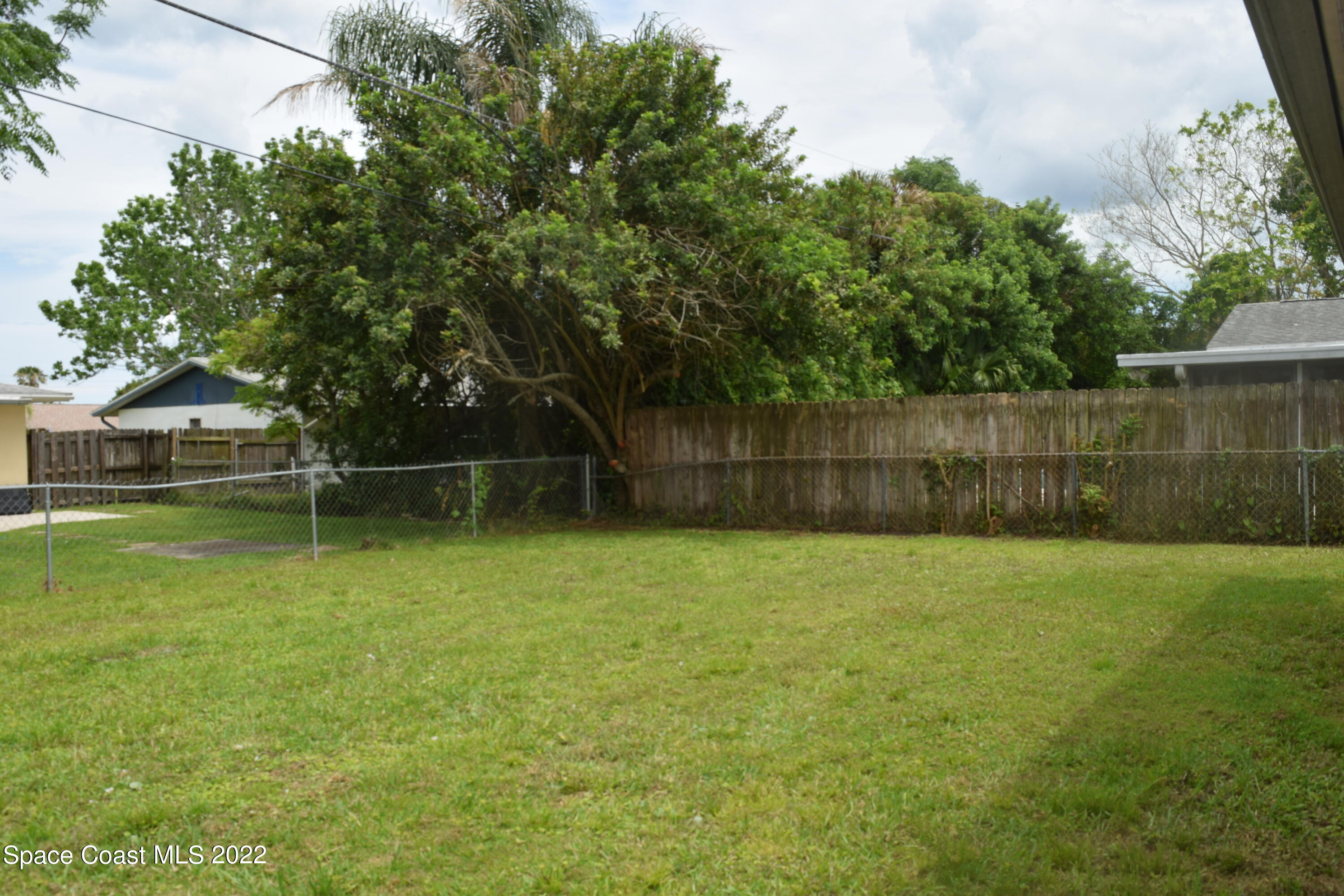 771 Cobblestone Lane Northeast Palm Bay, FL 32905 - Photo 27 of 30 a view of a backyard