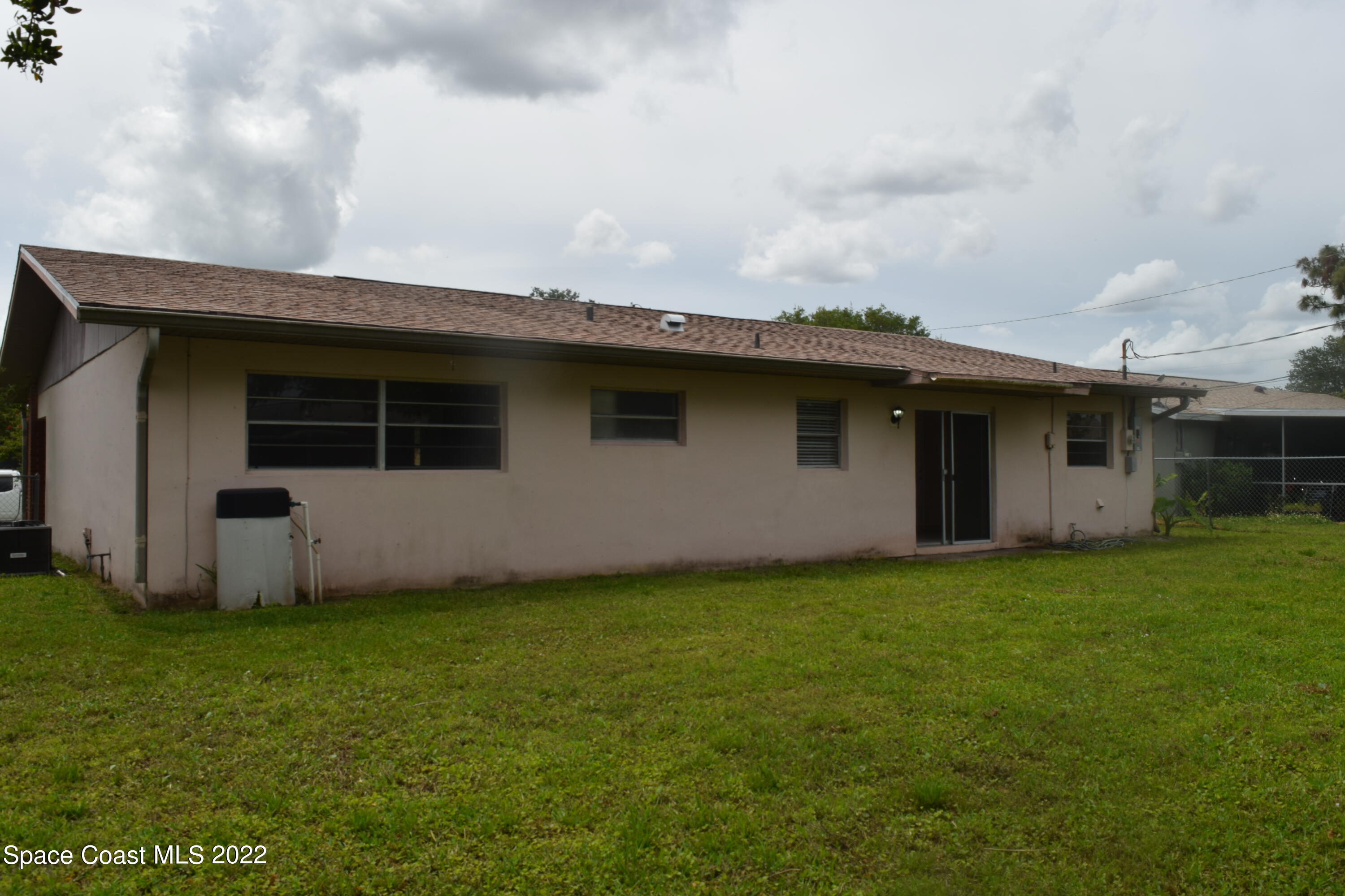 771 Cobblestone Lane Northeast Palm Bay, FL 32905 - Photo 29 of 30 a view of a back yard of the house