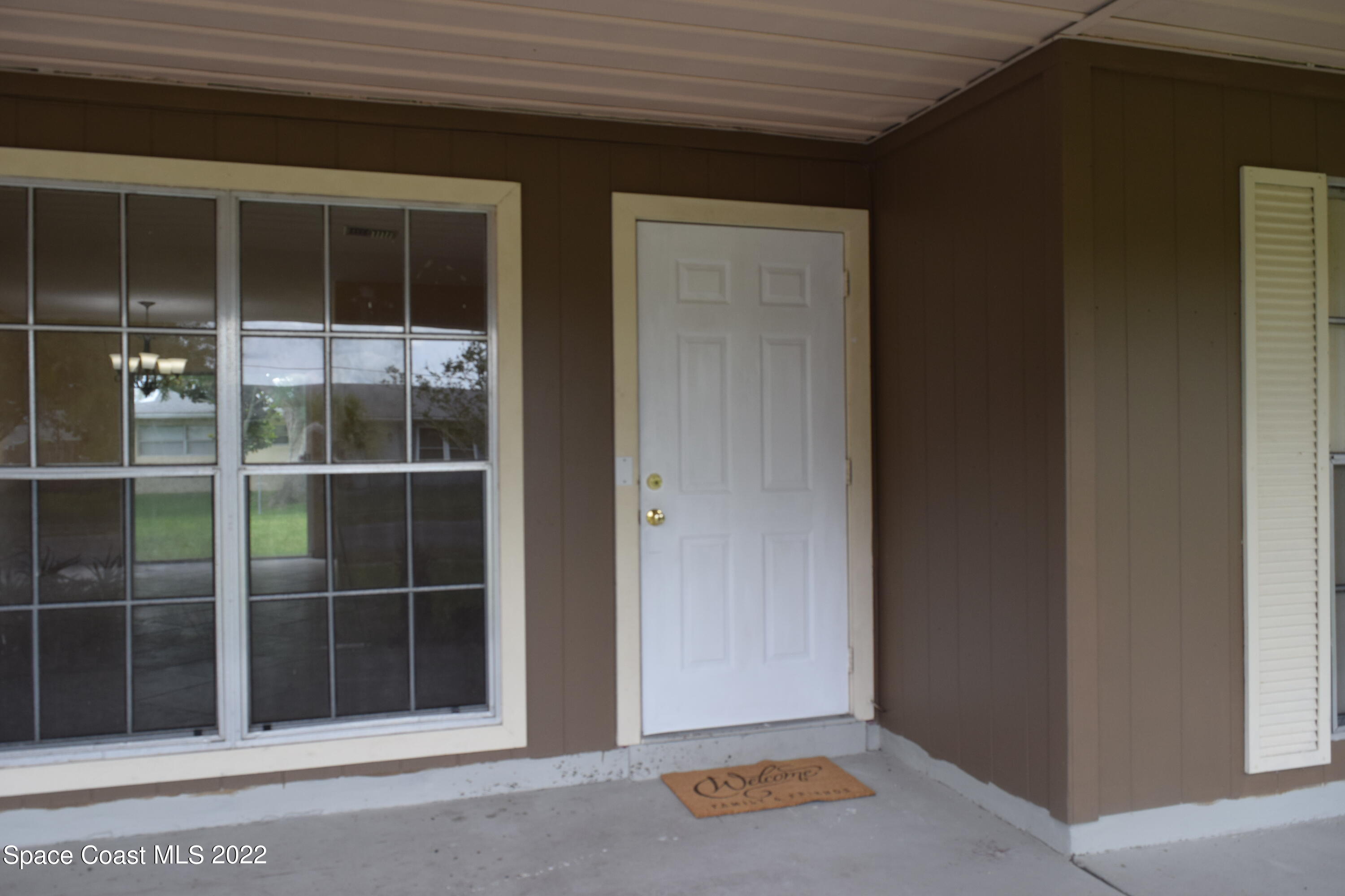 771 Cobblestone Lane Northeast Palm Bay, FL 32905 - Photo 4 of 30 a view of front door