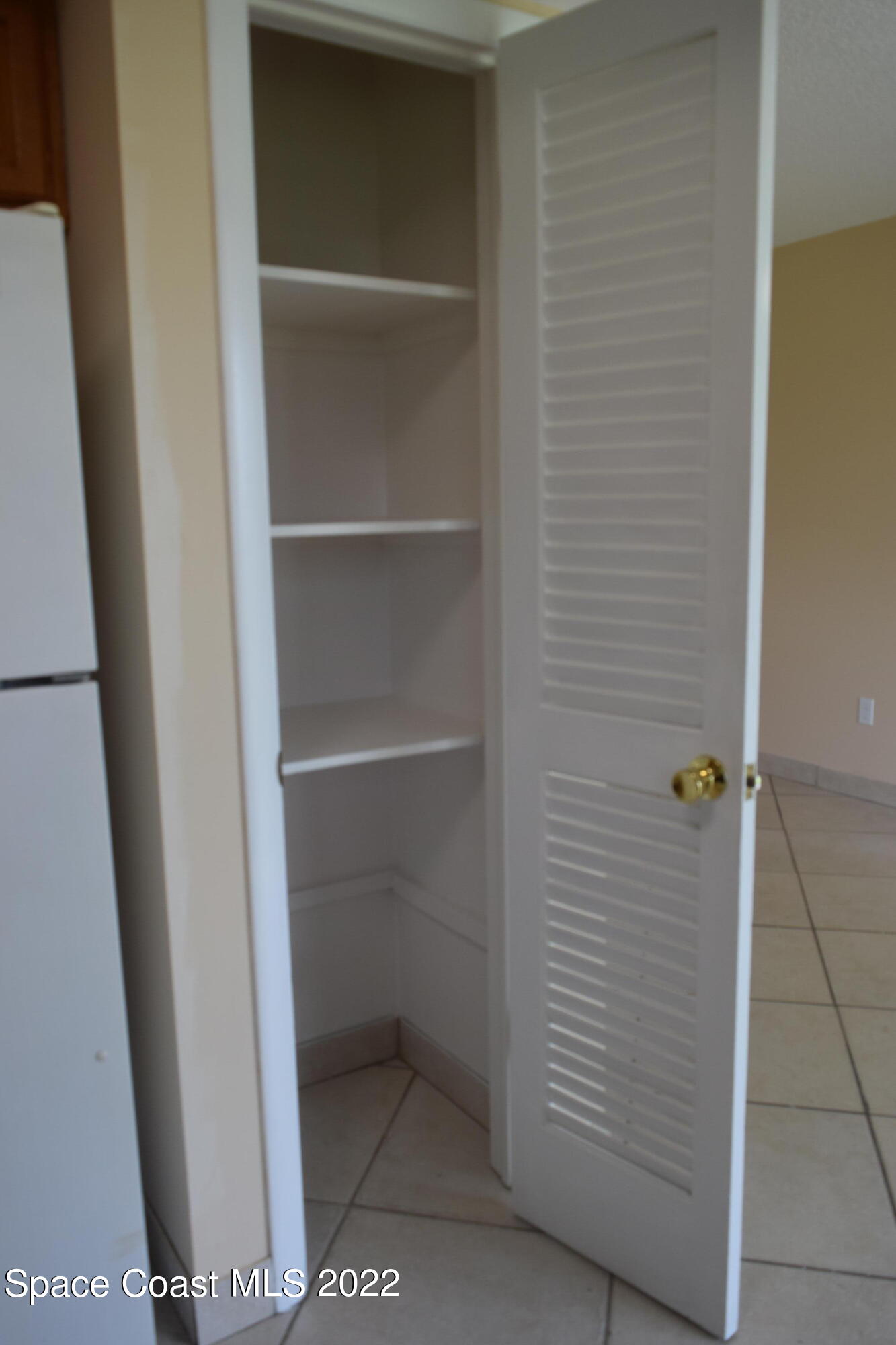 771 Cobblestone Lane Northeast Palm Bay, FL 32905 - Photo 9 of 30 a view of an empty walk in closet