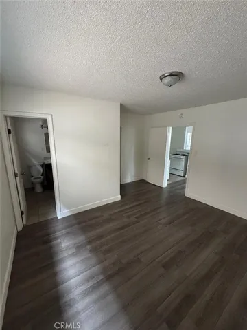 a view of a livingroom with wooden floor