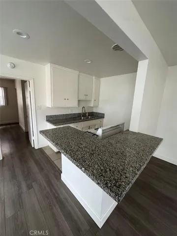 a kitchen with wooden floors