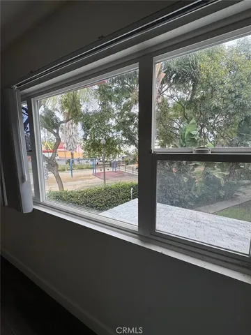 a view of a room that has a large window