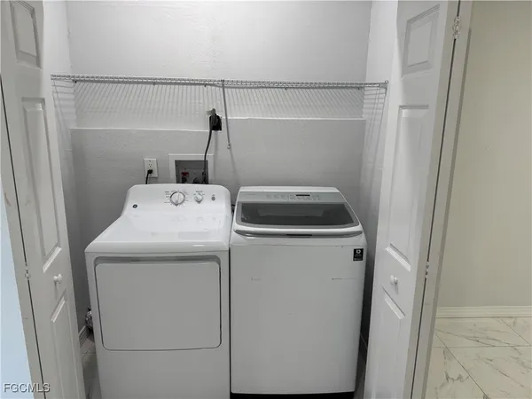 a utility room with dryer and washer