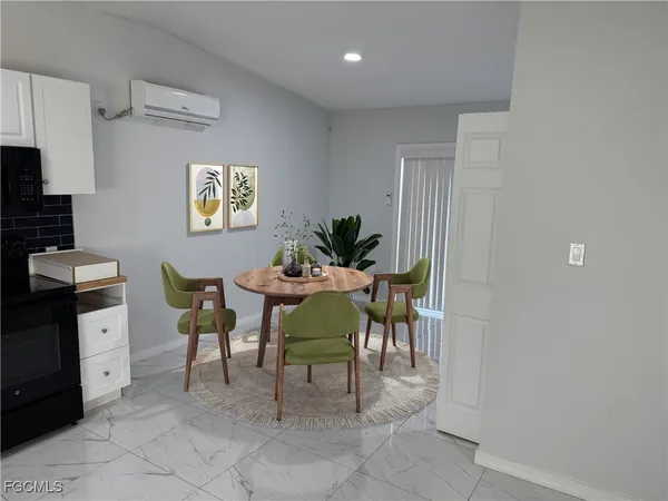 a view of a dining room with furniture