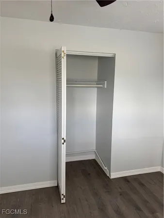 an empty room with wooden floor