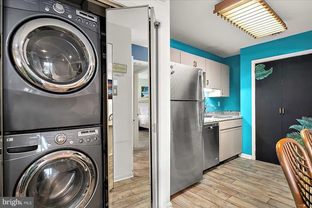 a kitchen with a refrigerator and washer
