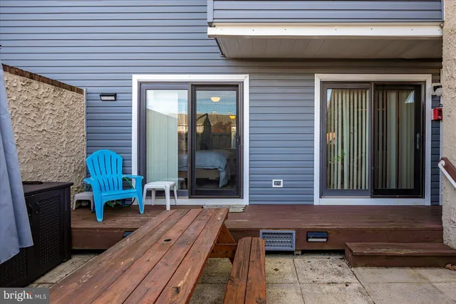 a view of a two chairs with the bench in front of house