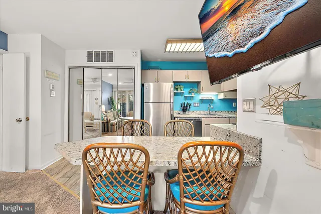 a view of a chairs and table in the patio