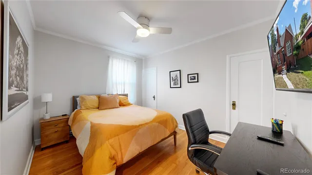 a bedroom with a bed and a bookshelf