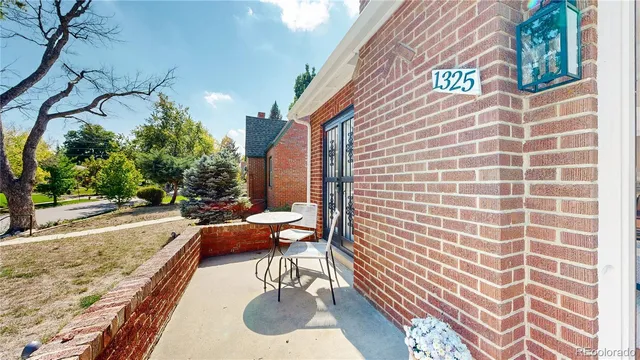 a backyard of a house with outdoor seating
