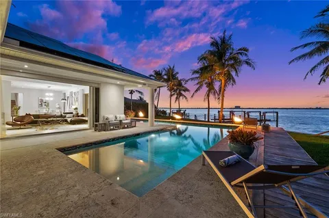 a view of swimming pool with outdoor seating
