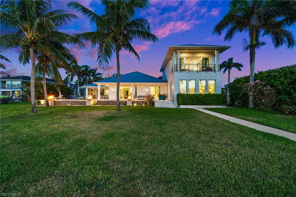 5625 Riverside Drive Cape Coral, FL 33904 - Photo 12 of 50 a front view of house with yard and green space