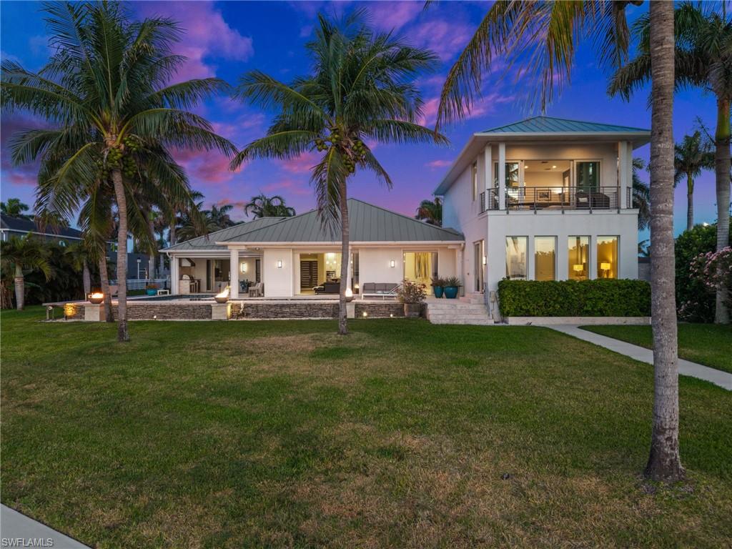 5625 Riverside Drive Cape Coral, FL 33904 - Photo 16 of 50 a front view of a house with a garden