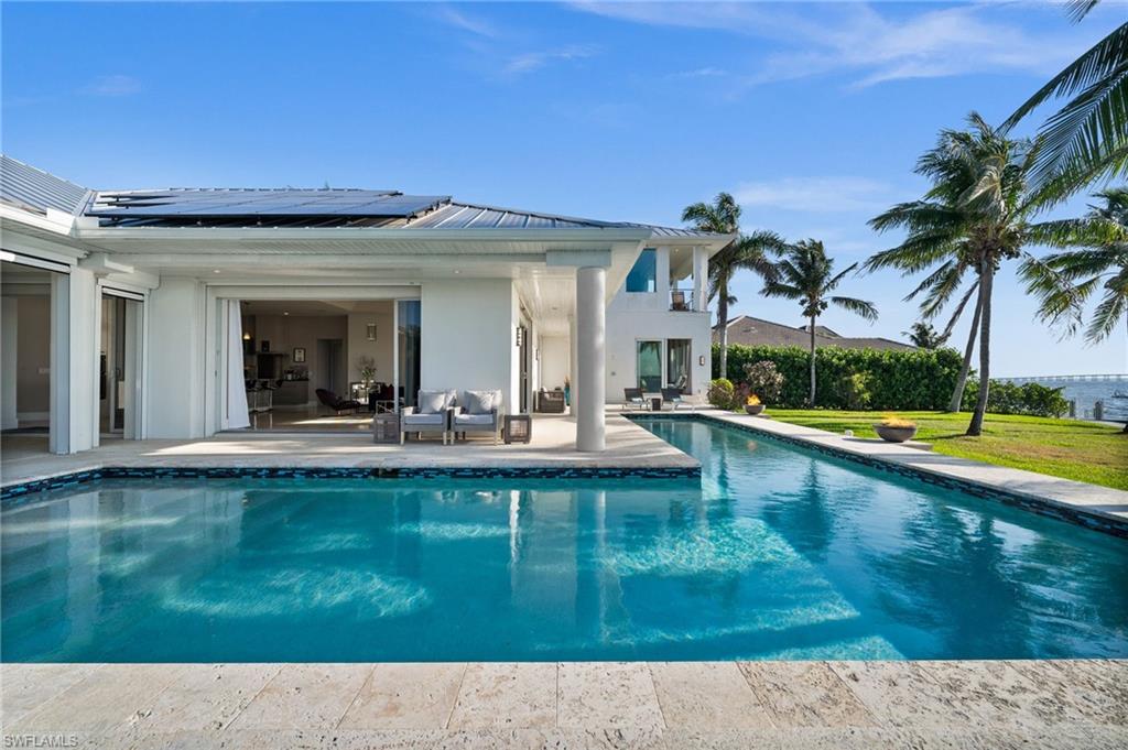 5625 Riverside Drive Cape Coral, FL 33904 - Photo 24 of 50 a swimming pool with outdoor seating