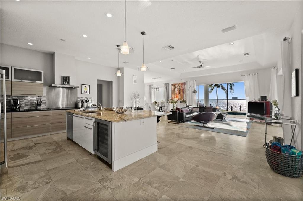 5625 Riverside Drive Cape Coral, FL 33904 - Photo 32 of 50 a large white kitchen with lots of counter space