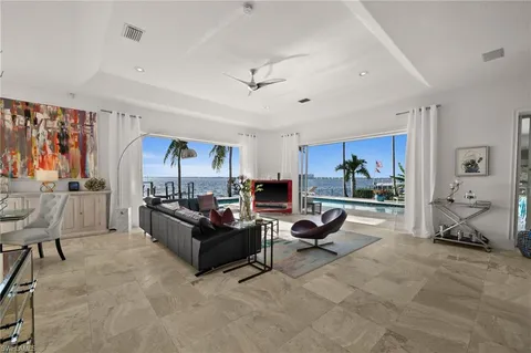 a view of a kitchen with dining table and chairs