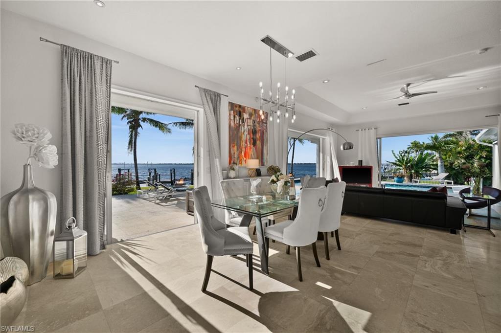 5625 Riverside Drive Cape Coral, FL 33904 - Photo 40 of 50 a view of a dining room with furniture and a chandelier