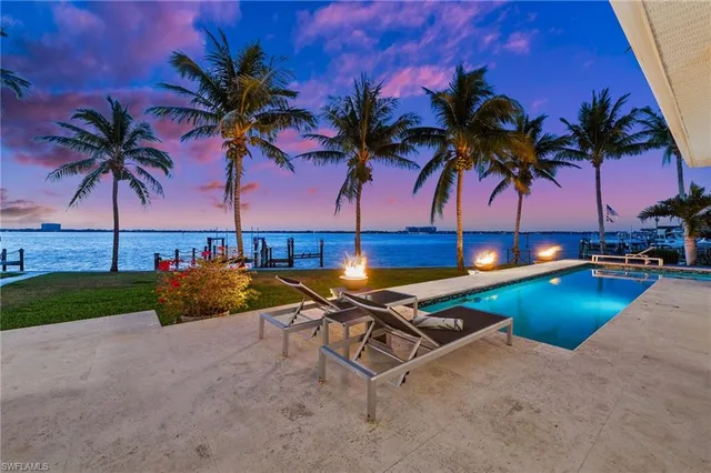 a view of a living room and kitchen