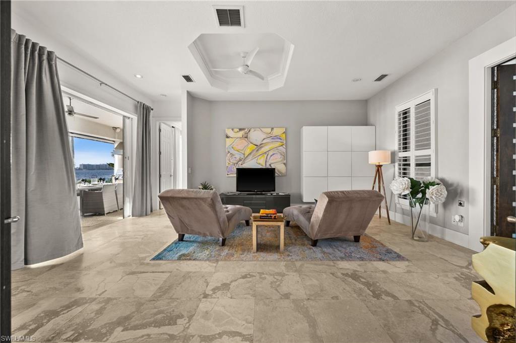 5625 Riverside Drive Cape Coral, FL 33904 - Photo 48 of 50 a living room with furniture and a fireplace