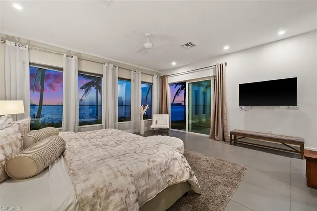 a bedroom with a large bed and a couch