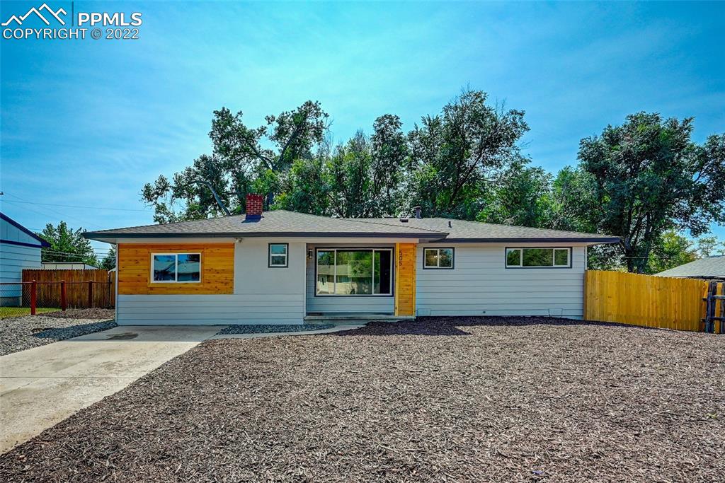 front view of a house with a yard