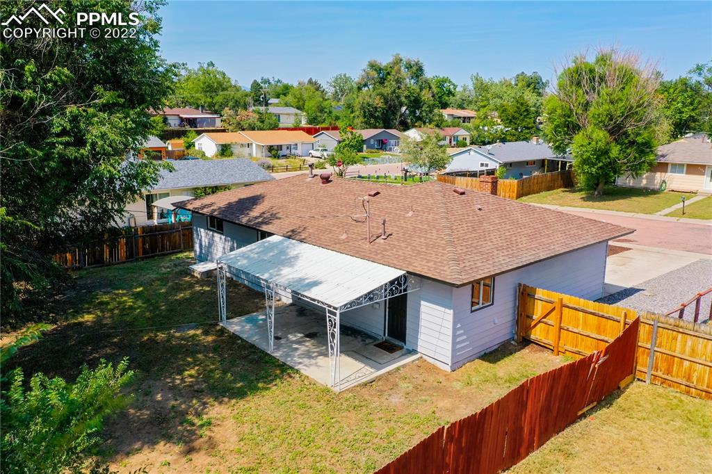 505 Inca Drive Colorado Springs, CO 80911 - Photo 17 of 33 an aerial view of a house with swimming pool and large trees