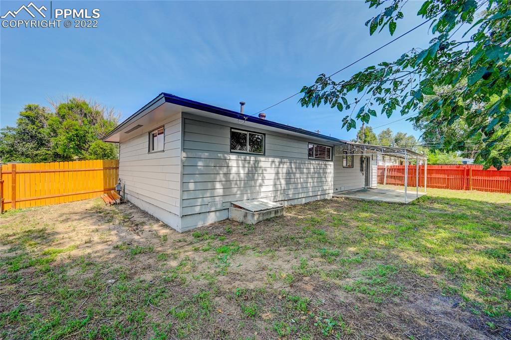 505 Inca Drive Colorado Springs, CO 80911 - Photo 20 of 33 a view of a backyard with a garden