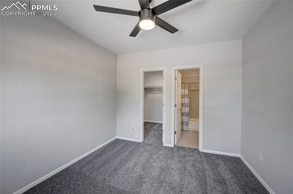 505 Inca Drive Colorado Springs, CO 80911 - Photo 29 of 33 an empty room with closet and a ceiling fan