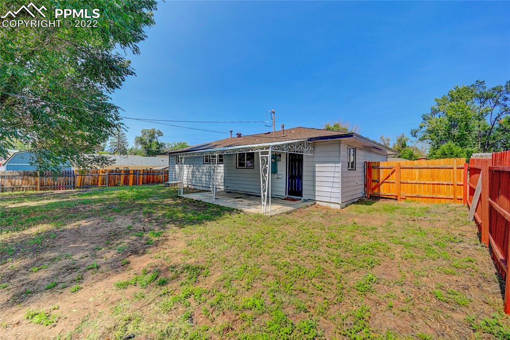 505 Inca Drive Colorado Springs, CO 80911 - Photo 4 of 33 a view of a house with backyard and trees