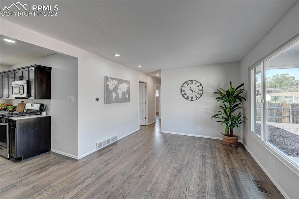 505 Inca Drive Colorado Springs, CO 80911 - Photo 6 of 33 a view of a kitchen with an entryway and wooden floor