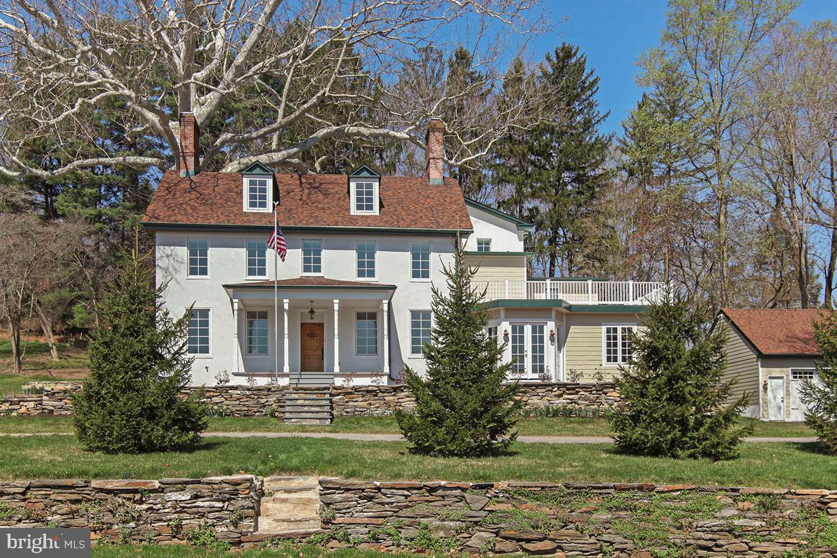 603 Beatty Road Media, PA 19063 - Photo 1 of 84 a front view of a house with a garden