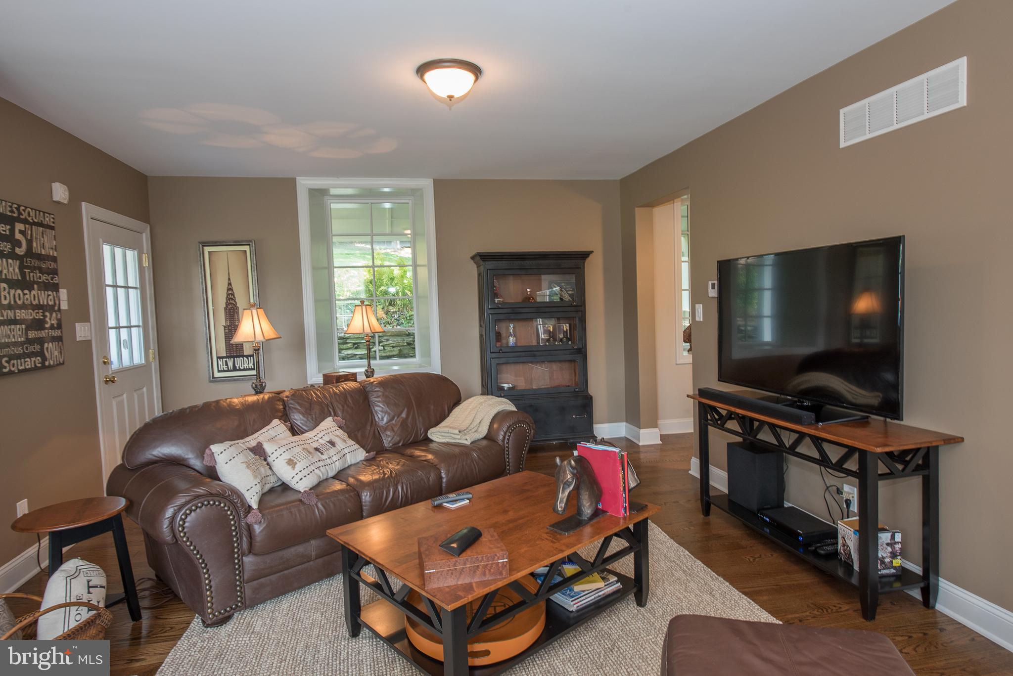 603 Beatty Road Media, PA 19063 - Photo 15 of 84 a living room with furniture and a flat screen tv