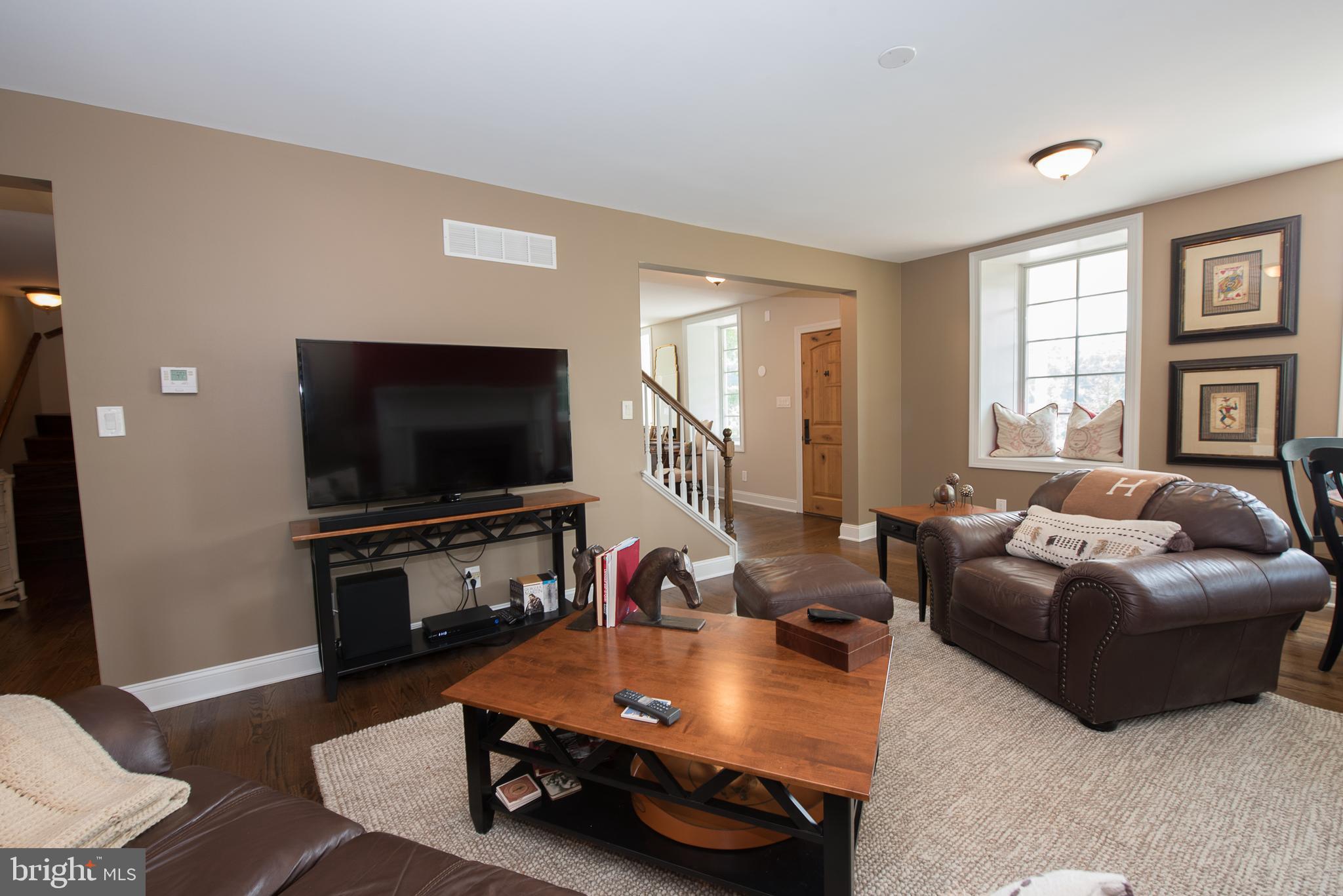 603 Beatty Road Media, PA 19063 - Photo 16 of 84 a living room with furniture and a flat screen tv