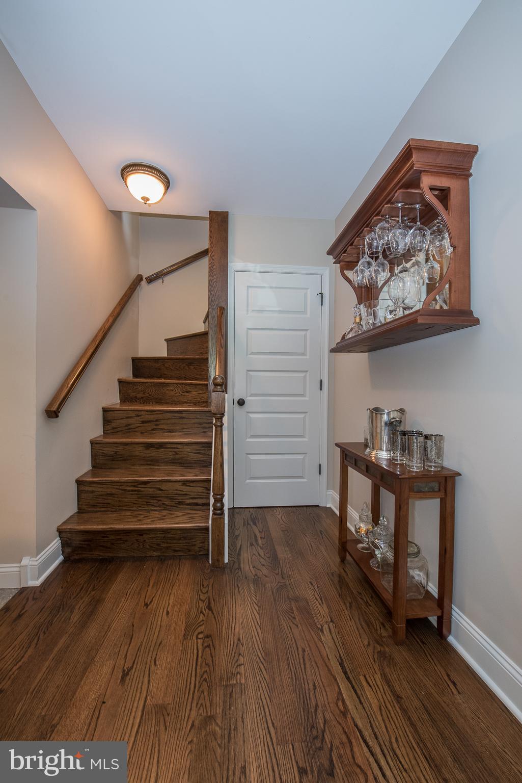 603 Beatty Road Media, PA 19063 - Photo 18 of 84 a view of a hallway with wooden floor and stairs